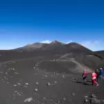 people hiking on mount etna