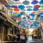 Colored umbrellas in a street market in Catania